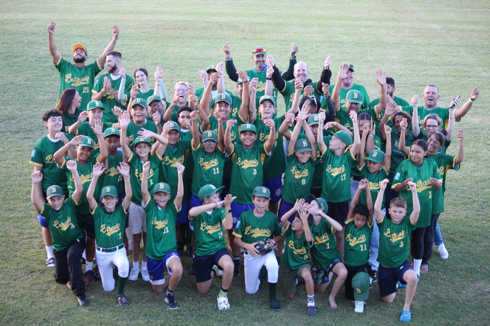 Bothasig Baseball Club players, coaches, and families celebrating together on the field