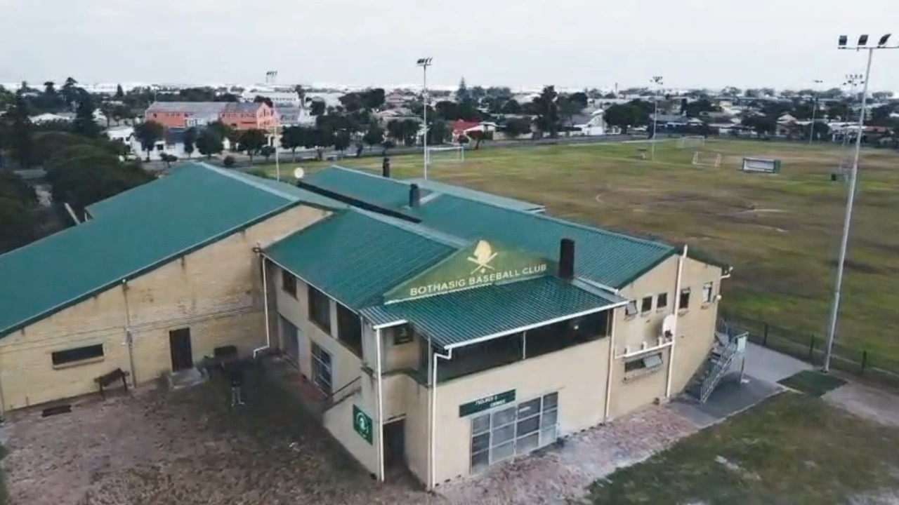 Aerial cinematic view of Abe Sher Stadium, home of Bothasig Baseball Club, Bothasig, Cape Town